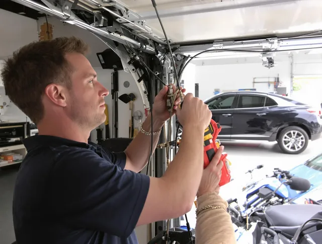 Pico Rivera Garage Door Repair safety certified technician performing cable replacement in Pico Rivera
