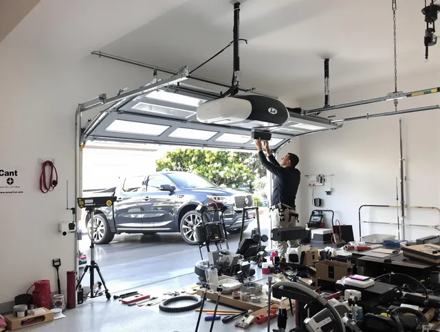 Pico Rivera Garage Door Repair specialist installing smart garage door opener system in Pico Rivera home